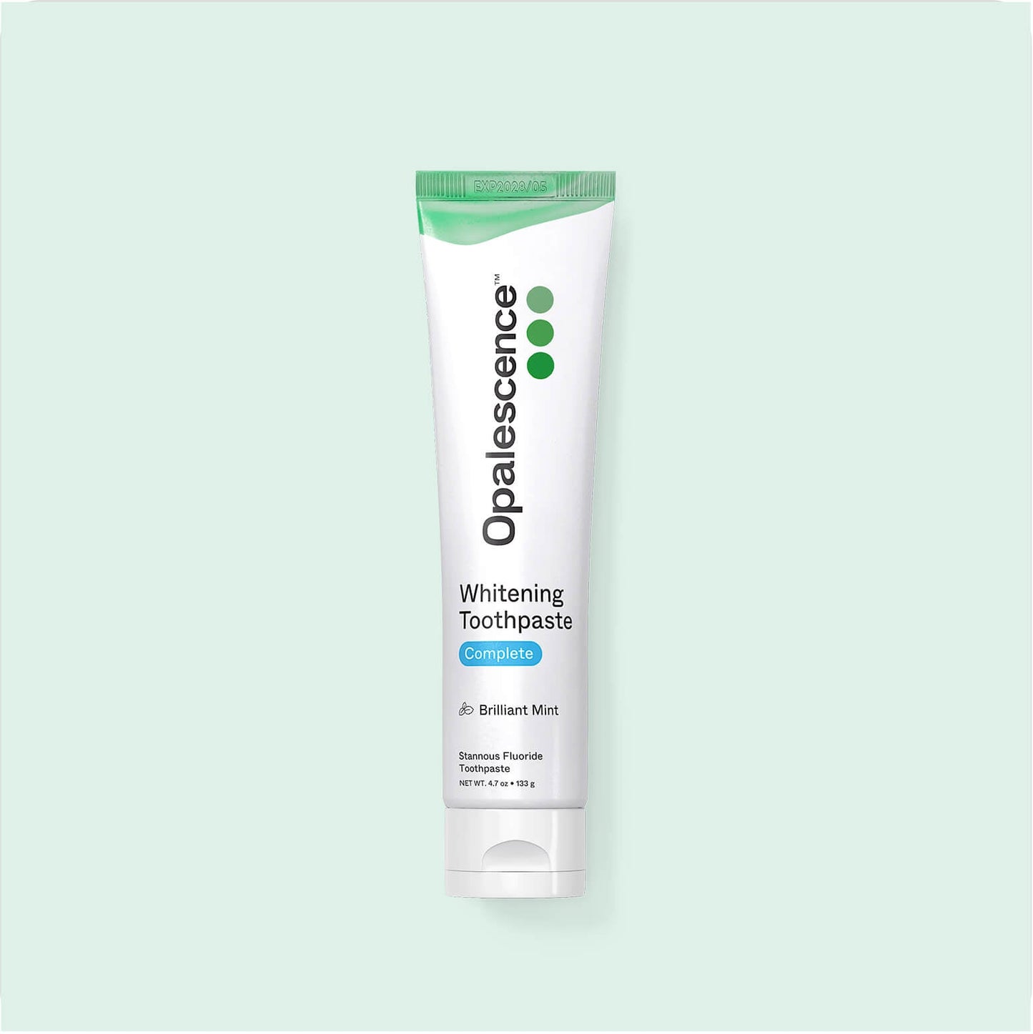 Opalescence whitening toothpaste tube on a light green background