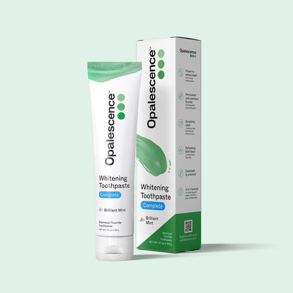 Opalescence whitening toothpaste tube and packaging on a light green background