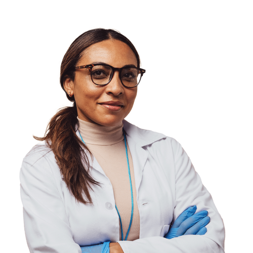 Dentist wearing glasses looking at the camera in a white lab coat and blue gloves 
