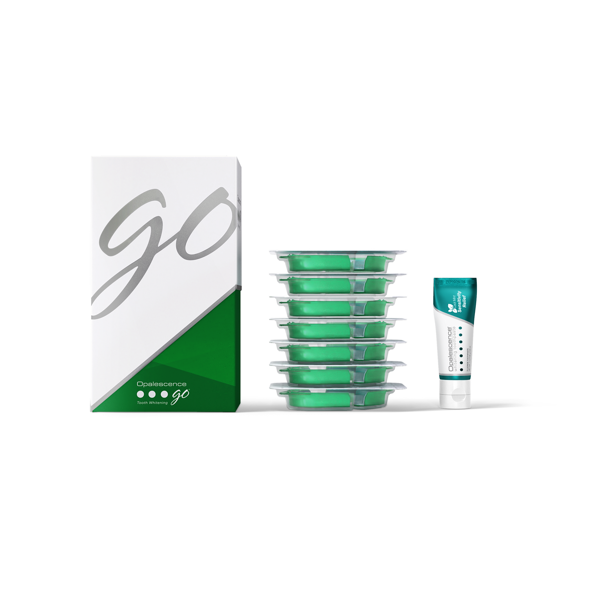 Green dental floss containers with a box labeled 'GO' on a white background and a travel size tube of toothpaste 