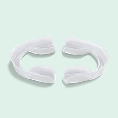 Upper and lower Opalescence Go Advanced 15% Prefilled Whitening Trays displayed on a light mint green background.